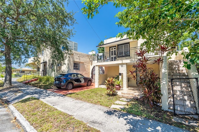 view of front of home with a balcony