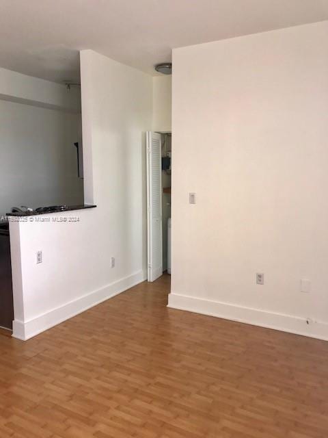 spare room with hardwood / wood-style flooring