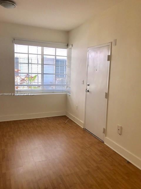 empty room featuring wood-type flooring