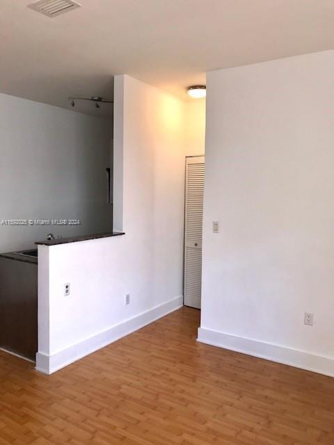 empty room featuring dark hardwood / wood-style floors