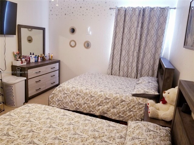 bedroom with light colored carpet