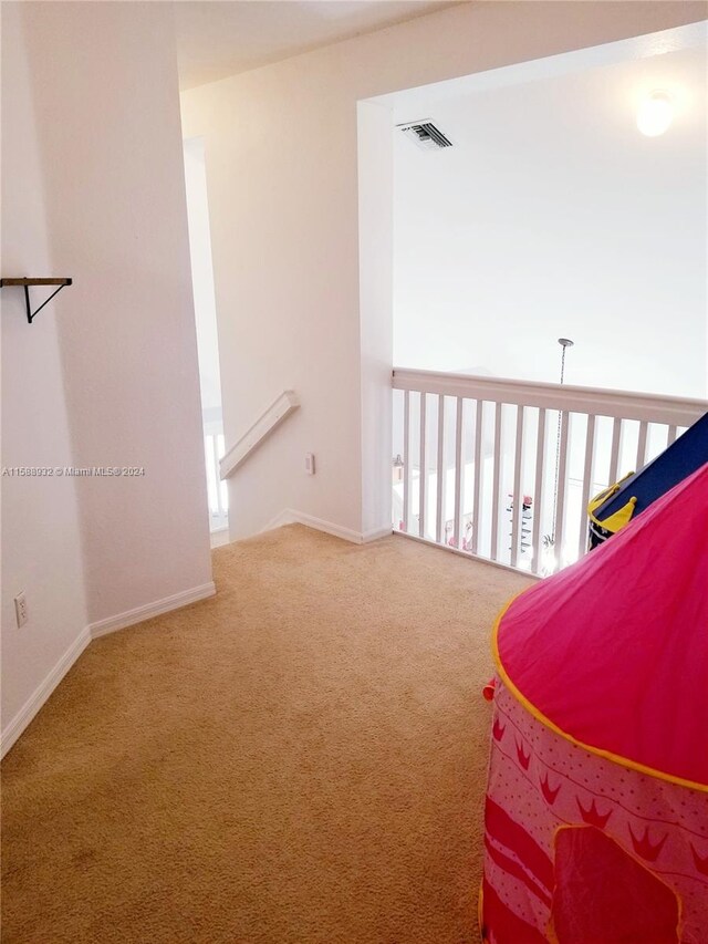 living area featuring carpet flooring