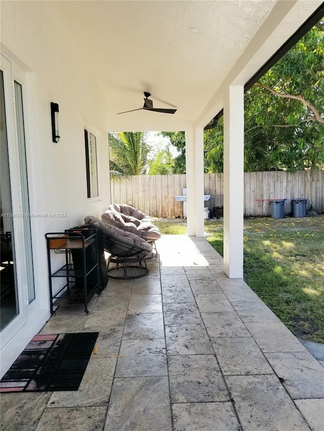 view of patio featuring ceiling fan