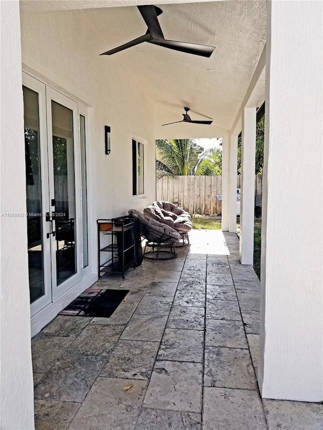 view of patio / terrace featuring french doors and ceiling fan