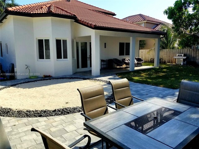 rear view of property featuring a patio