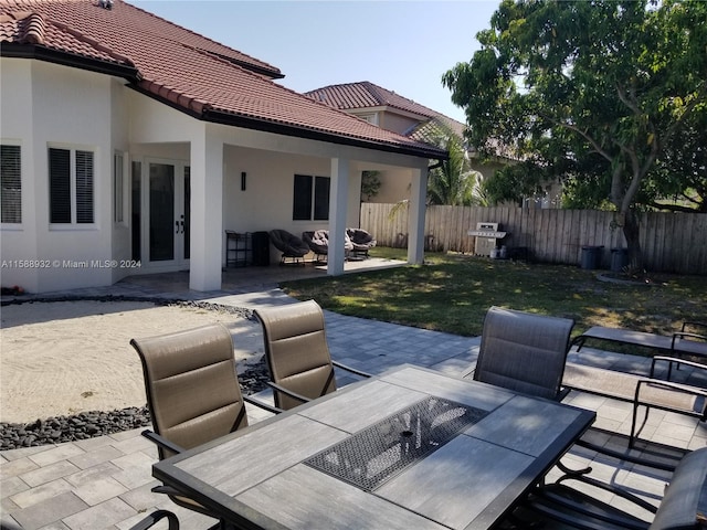 view of patio featuring a grill