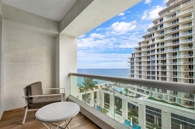 balcony featuring a water view