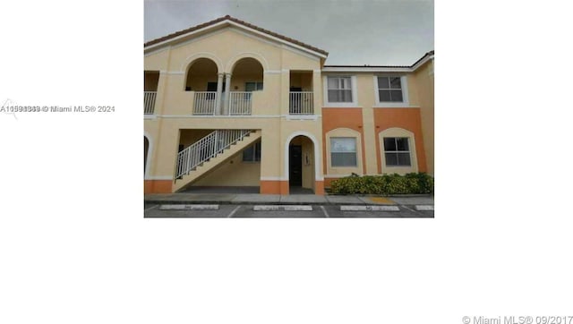 view of front of home with a balcony