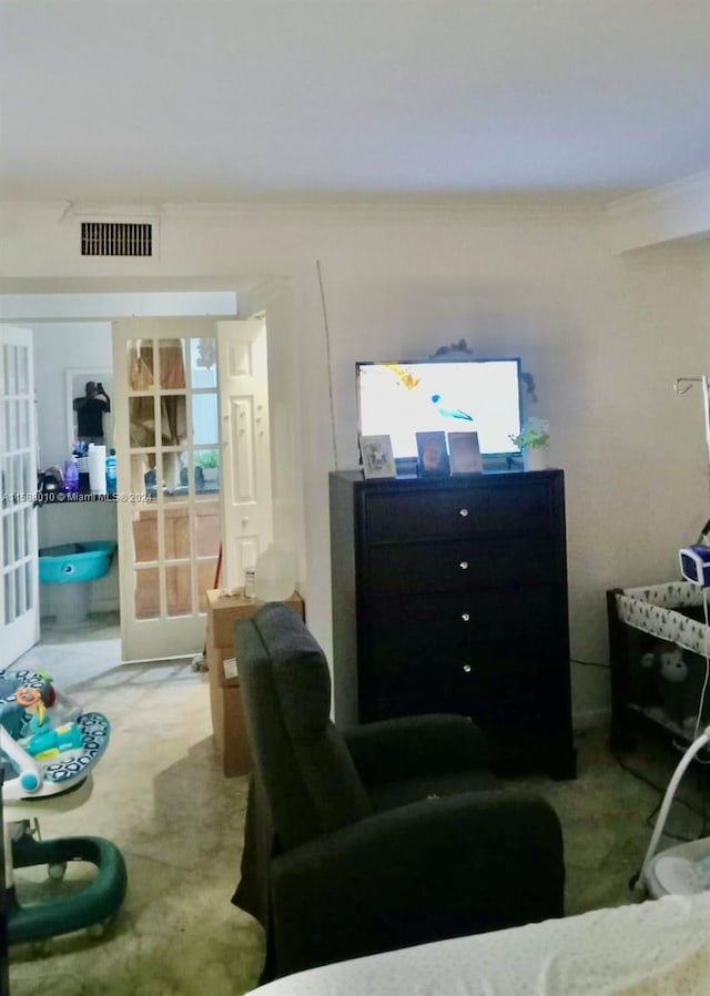 living room featuring ornamental molding and french doors