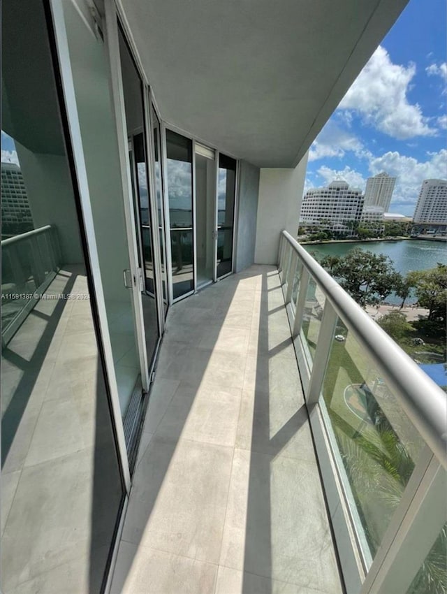 balcony featuring a water view