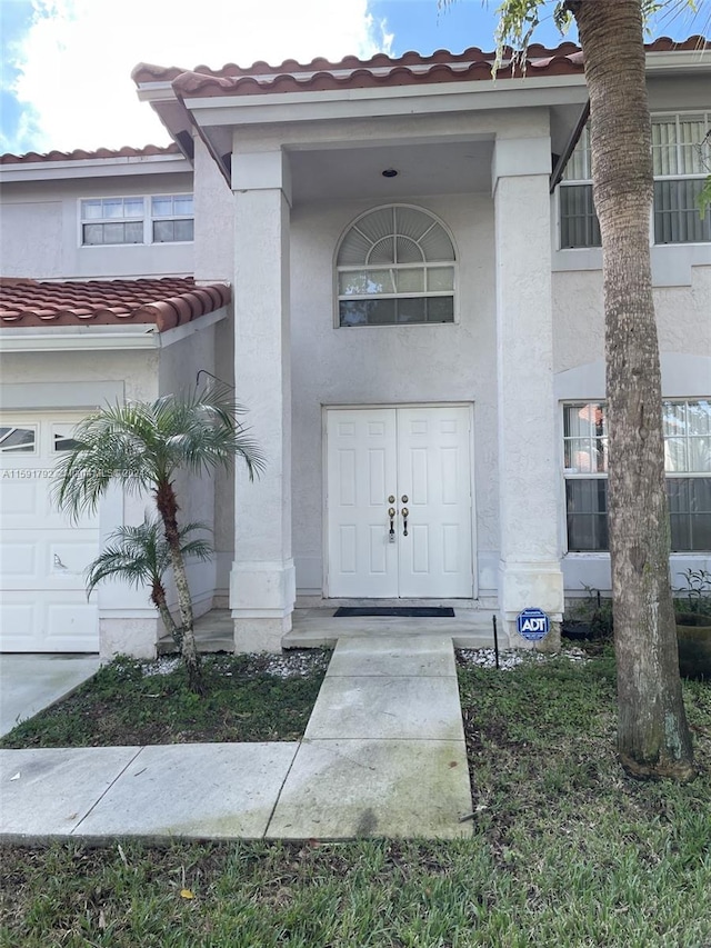 entrance to property featuring a garage