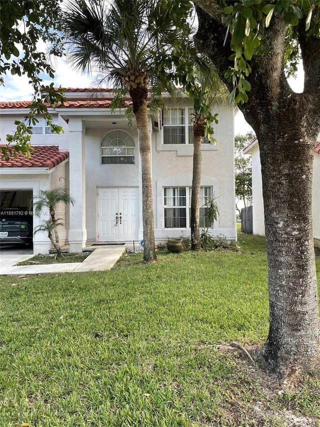 view of front of property with a front lawn