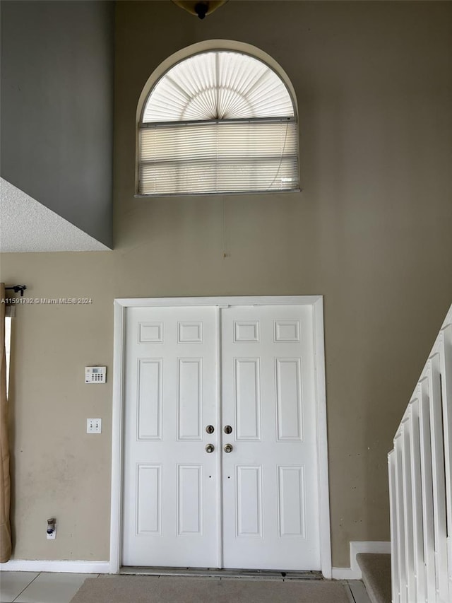 foyer entrance with tile floors