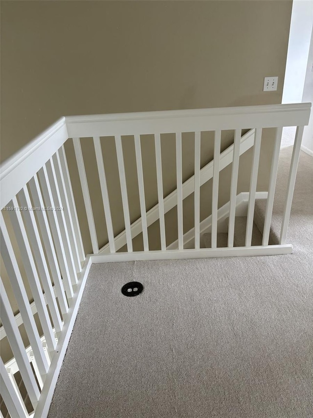 stairway with carpet flooring