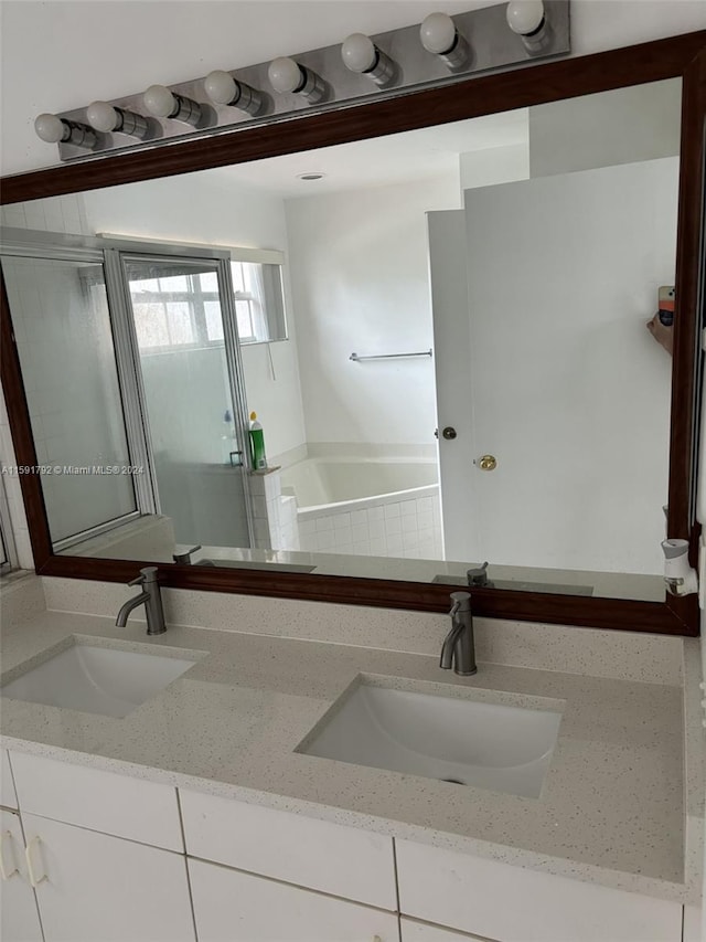 bathroom with oversized vanity and double sink