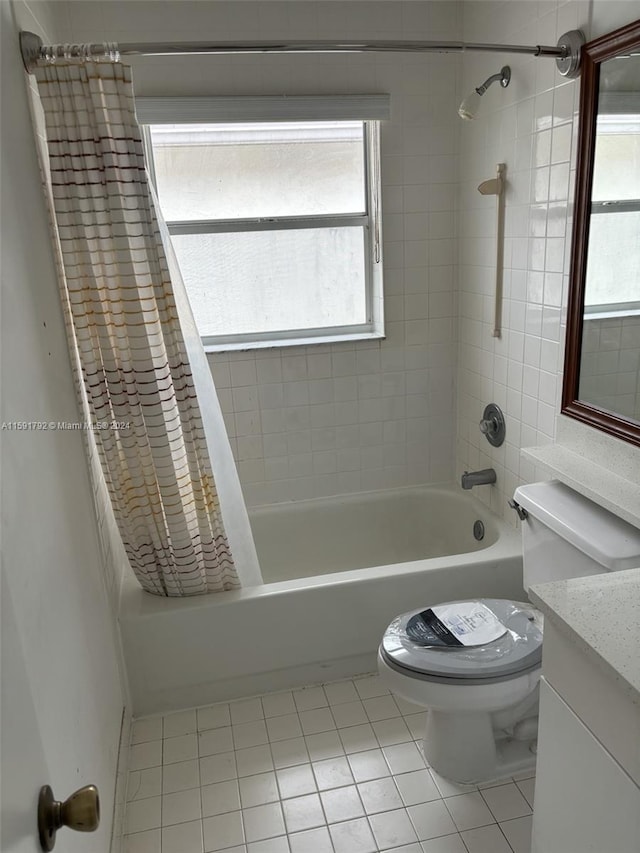 full bathroom featuring tile flooring, shower / bath combination with curtain, vanity, and toilet