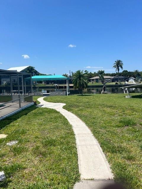 view of nearby features with a lawn and a water view