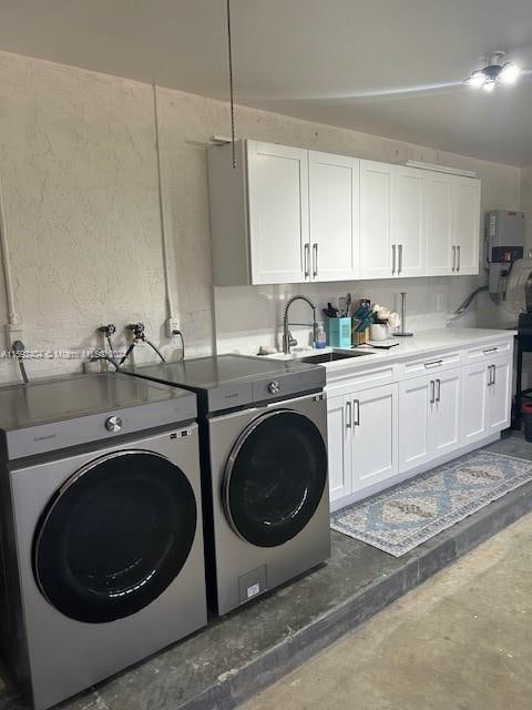 laundry room with washer and dryer, cabinets, washer hookup, water heater, and sink