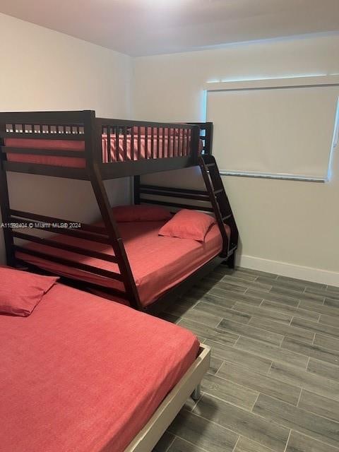 bedroom featuring dark wood-type flooring