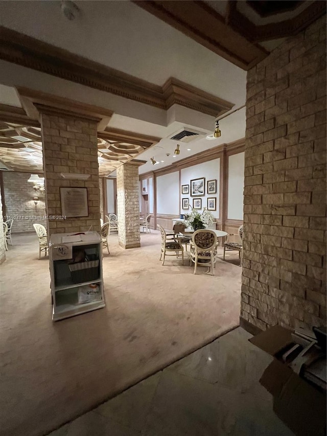 basement featuring crown molding and carpet flooring