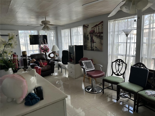 tiled living room featuring ceiling fan