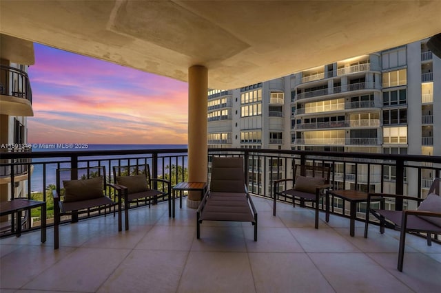 balcony featuring a water view