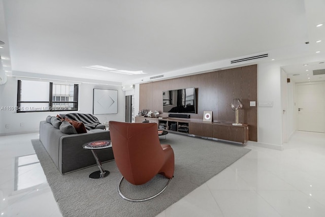 living room with light tile patterned flooring, visible vents, and recessed lighting