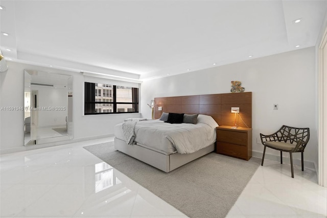 bedroom with baseboards, a tray ceiling, and recessed lighting