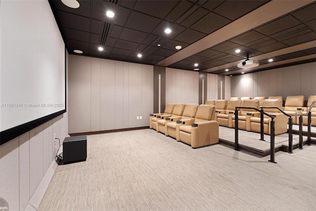 carpeted cinema with recessed lighting and a decorative wall