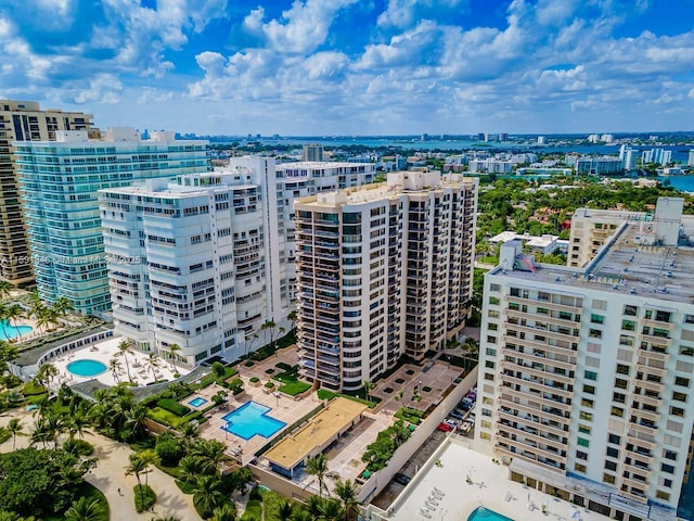 birds eye view of property featuring a city view