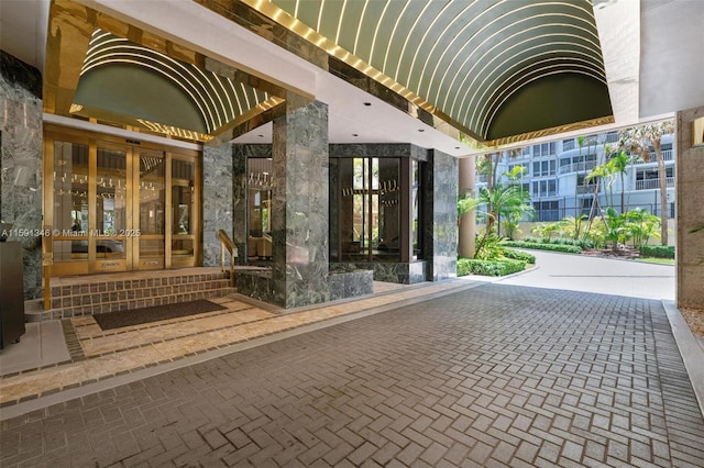 view of exterior entry featuring french doors