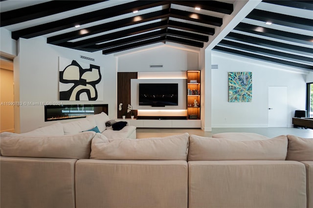 living room with lofted ceiling with beams