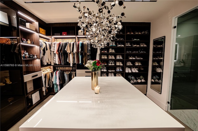 walk in closet featuring tile floors