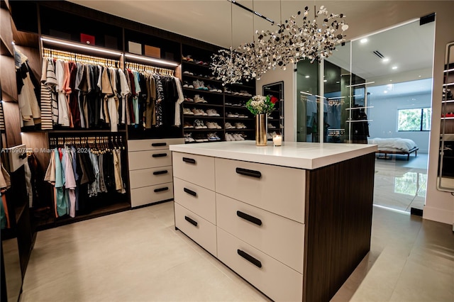 spacious closet featuring light tile floors