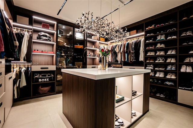 walk in closet featuring light tile floors