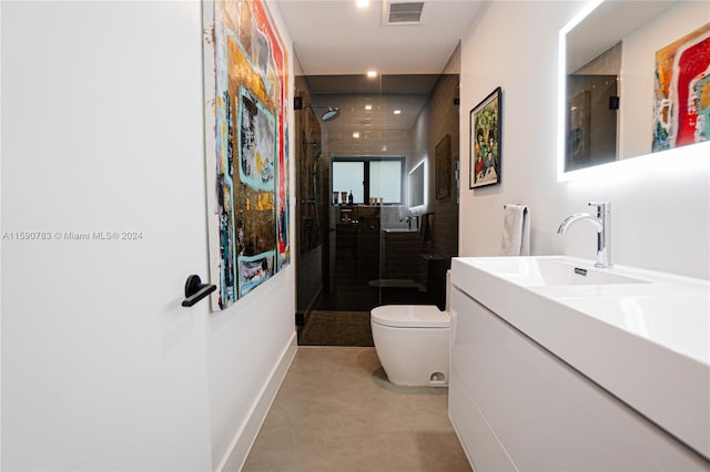 bathroom featuring an enclosed shower, toilet, and large vanity