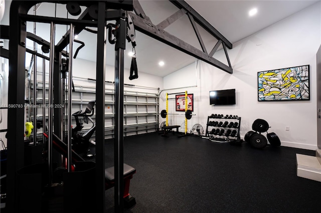 exercise room with lofted ceiling