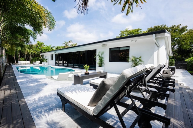 view of pool featuring a patio area