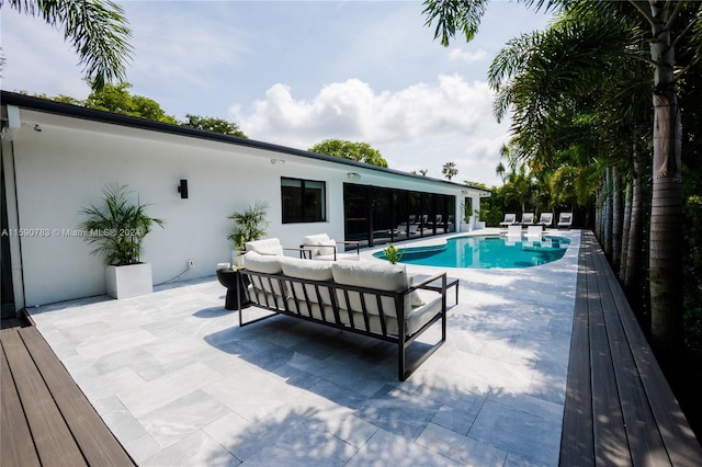 view of swimming pool with a patio area and an outdoor hangout area