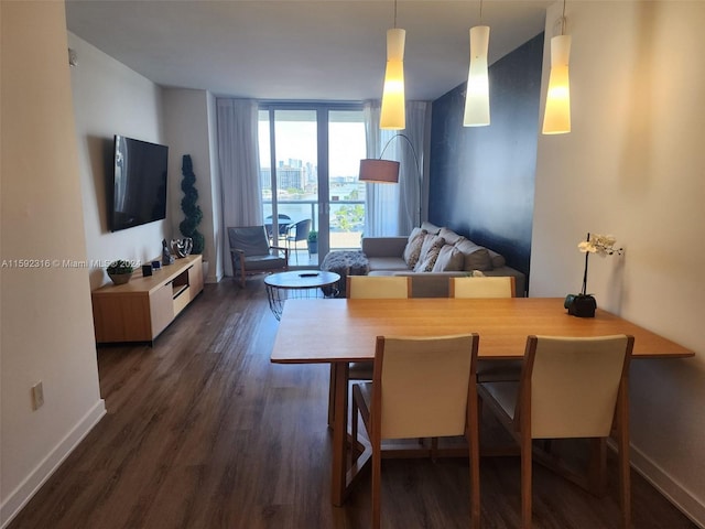 dining room featuring dark hardwood / wood-style floors and expansive windows