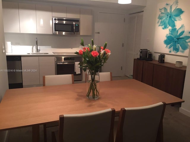 dining space featuring sink