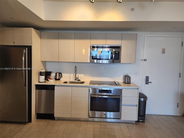 kitchen with appliances with stainless steel finishes and sink