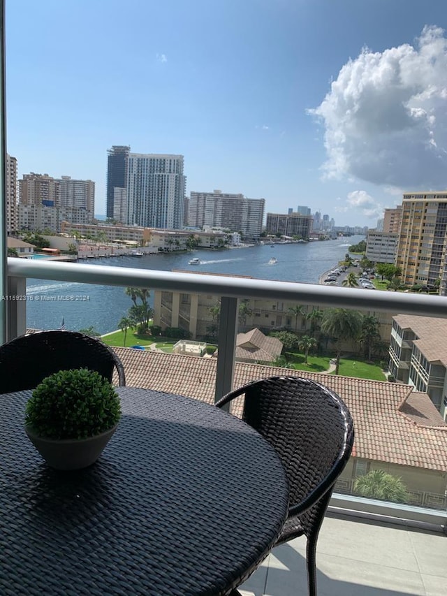 balcony featuring a water view