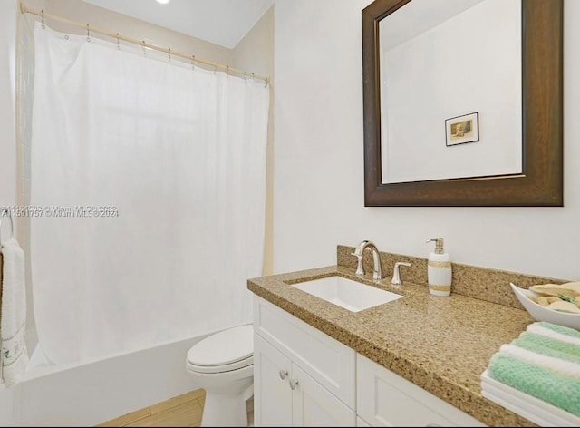 full bathroom with shower / tub combo, vanity, and toilet