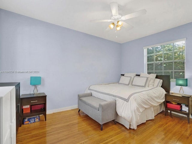 bedroom with ceiling fan and light wood-type flooring