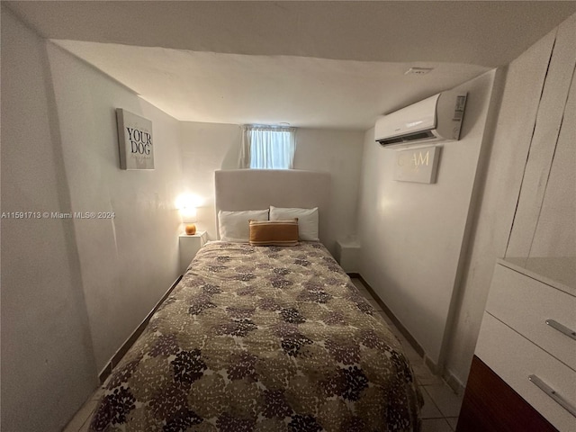 bedroom featuring a wall unit AC