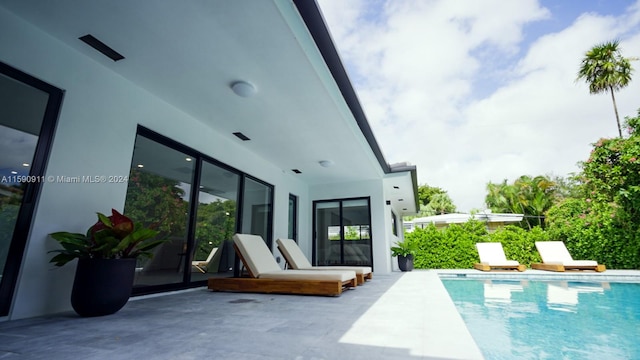 view of swimming pool featuring a patio area