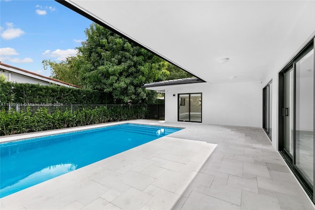 view of swimming pool featuring a patio