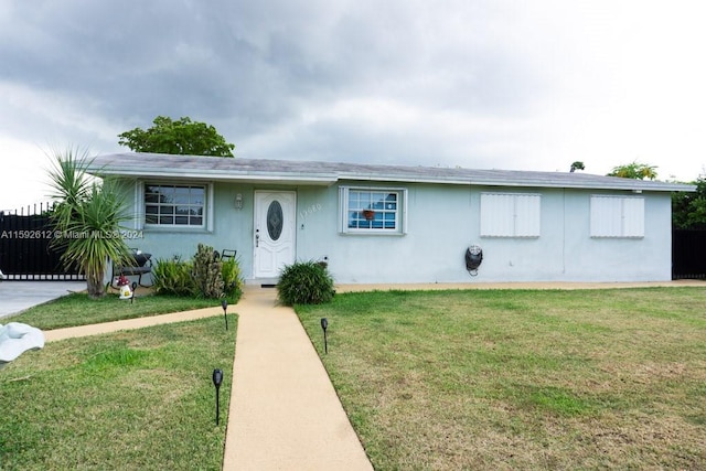 ranch-style house with a front yard