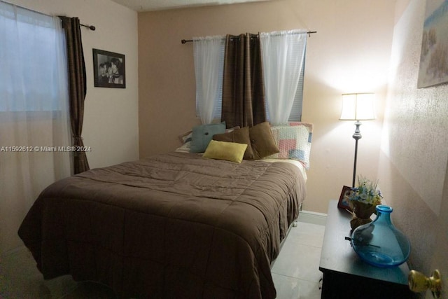 bedroom with tile floors